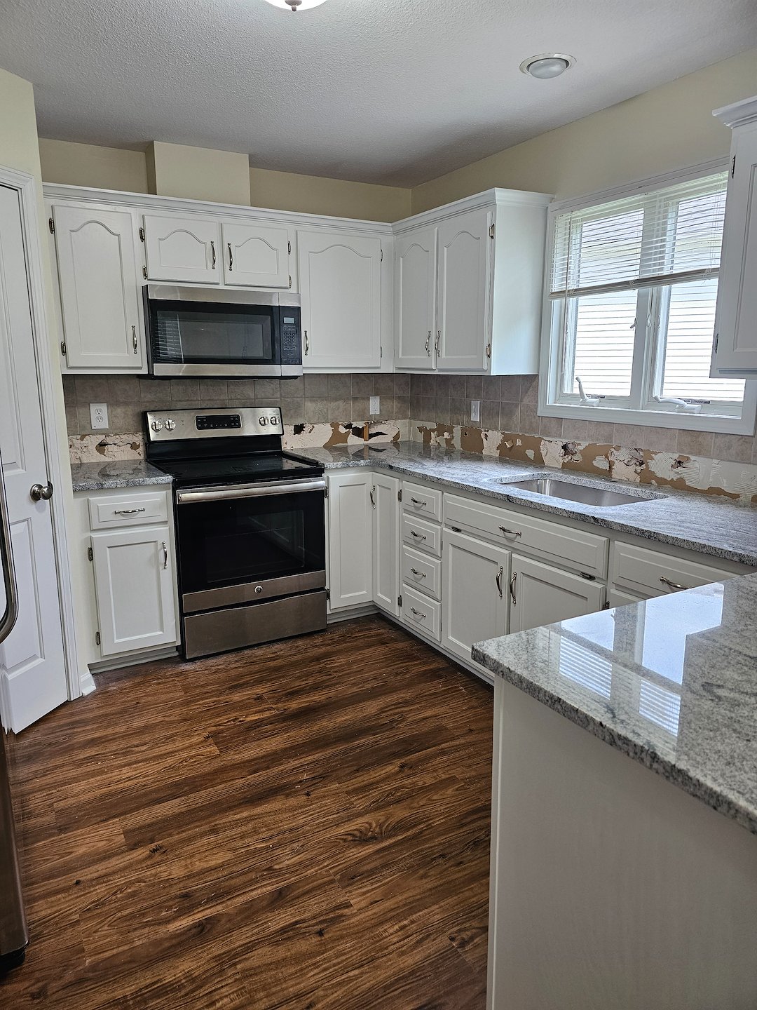 Dramatic kitchen cabinet makeover for this Lenexa Ks kitchen