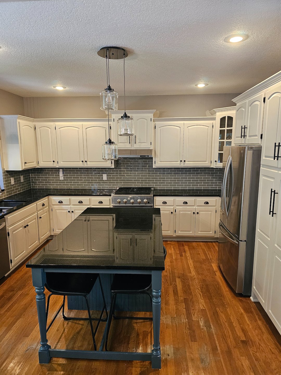 Two toned cabinet painting project in Parkville Mo 